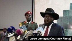 South Sudanese President Salva Kiir (R), shown delivering a speech to lawmakers, has retracted a statement that was widely perceived as a threat against journalists. 