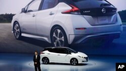 FILE - Nissan unveils its new Leaf electric vehicle during the world premiere in Chiba, Japan, Sept. 6, 2017.