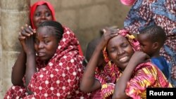 Relatives of missing school girls react in Dapchi in the northeastern state of Yobe, after an attack on the village by Boko Haram, Nigeria, Feb. 23, 2018. 