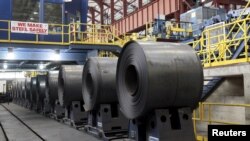 FILE - Rolled steel is seen after being treated on the pickle line at the Severstal steel mill in Dearborn, Michigan, June 21, 2012. 