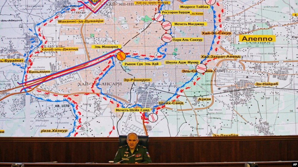 FILE - Lt. Gen. Sergei Rudskoi of the Russian military's General Staff speaks, in front of a map of the Aleppo area in Syria, at a briefing at the Russian Defense Ministry's headquarters in Moscow, Russia, Oct. 19, 2016.