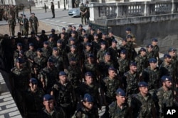 Soldiers rehearse outside the Royal Palace on June 18, a day before 46-year-old Prince Felipe will be proclaimed king in Madrid, Spain, on June 19.