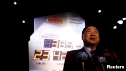 Lee Hee-beom, head of the Pyeongchang Organizing Committee for the 2018 Olympic and Paralympic Winter Games, speaks in front of the Olympic countdown clock after its unveiling ceremony in Seoul, South Korea, Feb. 8, 2017.