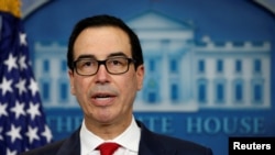 FILE - U.S. Treasury Secretary Steven Mnuchin, pictured at a White House briefing, June 29, 2017, has told lawmakers that maintaining U.S. creditworthiness is of "utmost importance." 