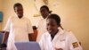 Rosemary Napeyok (right) in the Nadunget Health Center, located in Karamoja, northeastern Uganda, consults a doctor in Kampala over Skype, March 3, 2014. (Hilary Heuler for VOA News)