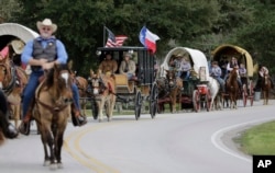 Sam Houston Trail Riders ride toward Spring Creek Park in Tomball, Texas, Feb. 23, 2016. More than 3,000 riders from 13 trail rides converged a few days later in Houston as part of the Houston Livestock Show and Rodeo.