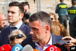 Santi Vila, Catalonia's regional chief for business, talks to journalists as he leaves the Estremera prison in Madrid, Nov. 3, 2017. He was the lone former member of the Catalan government to be released on bail Friday.