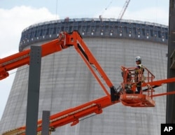 New reactor construction is shown at Plant Vogtle Nuclear Power Plant in Waynesboro, Ga. Friday, June 13, 2014. (AP Photo/John Bazemore)