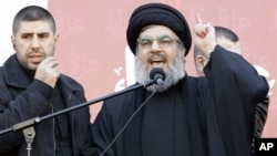 Hezbollah leader Sheik Hassan Nasrallah speaks to the crowd.