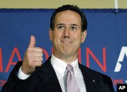 FILE - Republican presidential candidate, former Pennsylvania Sen. Rick Santorum gives a thumbs up during his election night party, March 13, 2012, in Lafayette, La.