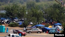 Evacuees from the Ranch Fire and River Fire (Mendocino Complex) are living in motor homes, cars and tents in the parking lot of the Moose Lodge in Clearlake Oaks, Calif., Aug. 2, 2018.