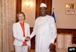 FILE - Chad’s President Idriss Deby shakes hands with France’s Minister of Army Forces Florence Parly before their meeting at the Presidential Palace in N’Djamena, Chad, July 31, 2017.