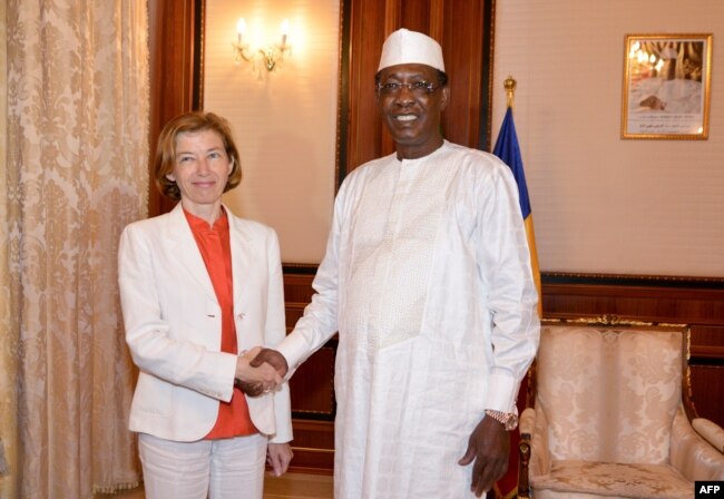 FILE - Chad’s President Idriss Deby shakes hands with France’s Minister of Army Forces Florence Parly before their meeting at the Presidential Palace in N’Djamena, Chad, July 31, 2017.