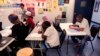 FILE - Refugees attend English class at Della Lamb Community Services in Kansas City, Mo., on June 13, 2016.