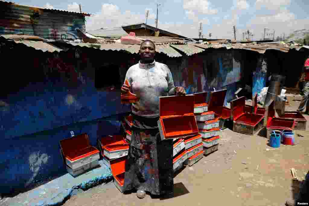 Christine Akoth, 38, a metal painter, poses for a photograph in Kenya&#39;s capital Nairobi, Feb. 27, 2017. &quot;I have experienced gender bias at my work where sometimes I&#39;m denied contracts because of who I am and maybe my marital status. Some female colleagues have been treated unfairly because of their sex and even exploited,&quot; Akoth said.