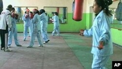 A group of young women are learning to box in the same Kabul stadium that was once used for Taliban executions, Kabul, Afghanistan, 2011.
