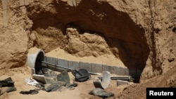 FILE - Part of a tunnel exposed by the Israeli military is seen on the Israeli side of the Israel-Gaza border, Aug. 14, 2014. During a 2014 operation, Israel destroyed 34 such tunnels, a military spokeswoman said.