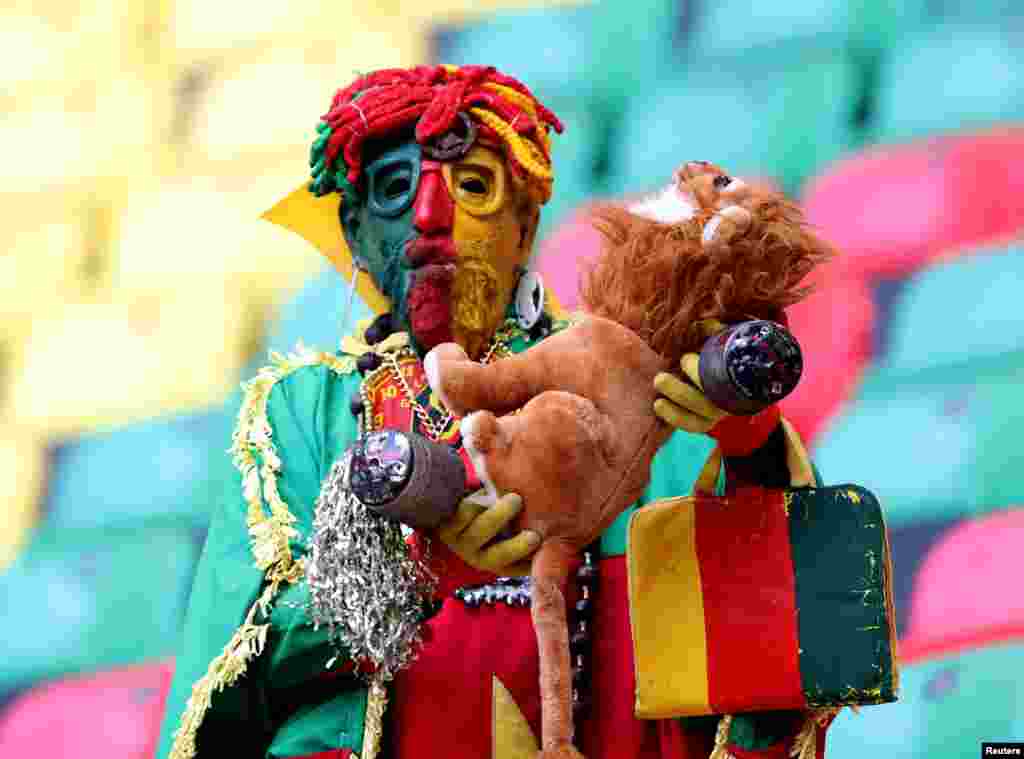 A Cameroonian fan in the stands before the match.