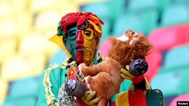 FILE - A Cameroon fan in the stands before the match Cameroon v Ethiopia, at Olembe Stadium in Yaounde, Jan. 13, 2022.