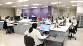 FILE - Chemists work at AstraZeneca's headquarters. Prime Minister Scott Morrison said Australians will be among the first in the world to receive a coronavirus disease (COVID-19) vaccine, if it proves successful.