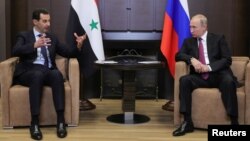 Russian President Vladimir Putin meets with Syrian President Bashar al-Assad in the Black Sea resort of Sochi, Russia, May 17, 2018. 
