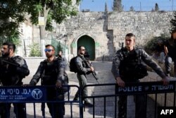 Israeli police forces stand guard the al-Aqsa mosque compound in the Jerusalem's Old City after it was closed off by Israeli authorities following clashes with Palestinian worshippers, July 27, 2018.