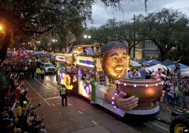 FILE: The Officer's Float rolls down Napoleon Avenue as the 1,600 men of Bacchus present their 32-float Mardi Gras parade entitled "Starring Louisiana" on the Uptown route in New Orleans on Sunday, March 3, 2019.