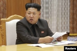 Kim Jong Un speaks at an emergency meeting of the Workers' Party of Korea (WPK) Central Military Commission in Pyongyang, in this undated photo from North Korea's Korean Central News Agency (KCNA), Aug. 21, 2015.