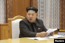 North Korean leader Kim Jong Un speaks at an emergency meeting of the Workers' Party of Korea (WPK) Central Military Commission in Pyongyang, in this undated photo released by North Korea's Korean Central News Agency (KCNA), Aug. 21, 2015.