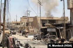 After Iraqi forces force IS out of an area, homes and cars are often destroyed and IS mortars continue to fall in Mosul, June 4, 2017.