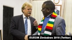 UE Chief Observer Elmar Brok and Zimbabwe President Emmerson Mnangagwa