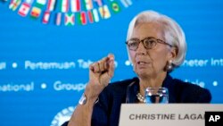 FILE - Managing Director of International Monetary Fund (IMF) Christine Lagarde talks during a press conference ahead of the annual meetings of the IMF and World Bank in Bali, Indonesia, Oct. 11, 2018. 