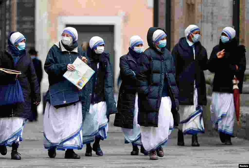 Nuns walk as the region enters the &#39;yellow zone&#39; after the government relaxed some of the COVID-19 curbs on weekdays following a strict lockdown over the holidays, in Rome, Italy.