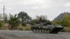 Ukraine Rebels Start Pullback of Heavy Artillery