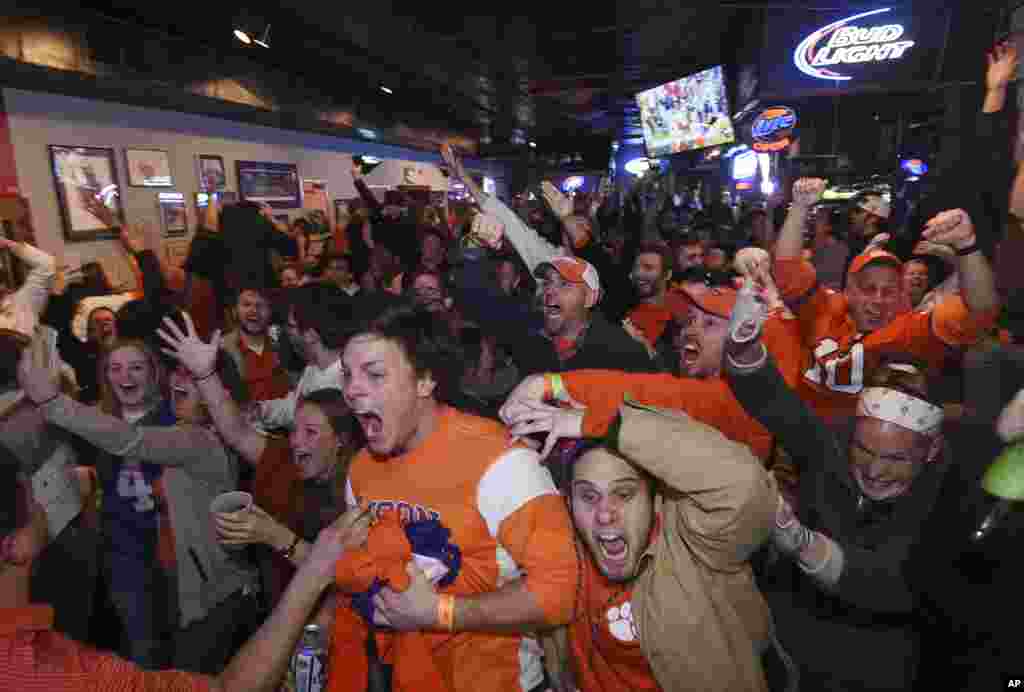 Clemson fans celebrate after the team scored the game-winning touchdown during the NCAA college football playoff championship against Alabama in Clemson, South Carolina, Jan. 9, 2017.