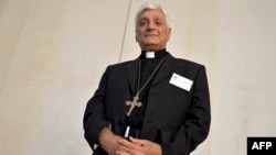 FILE - Chaldean bishop of the war-torn Syrian city of Aleppo, Antoine Audo, during an interview at the Pontifical Council for the Laity, at the Palazzo San Callisto, central Rome, Sept. 16, 2014. 