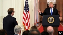 President Donald Trump takes questions as he speaks during a news conference in the East Room of the White House, Nov. 7, 2018, in Washington.