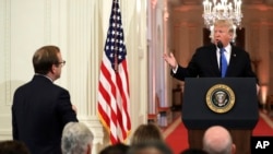 President Donald Trump takes questions as he speaks during a news conference in the East Room of the White House, Nov. 7, 2018, in Washington. 