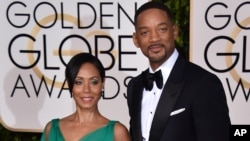 Jada Pinkett Smith, left, and Will Smith arrive at the 73rd annual Golden Globe Awards on Sunday, Jan. 10, 2016, at the Beverly Hilton Hotel in Beverly Hills, Calif. (Photo by Jordan Strauss/Invision/AP)