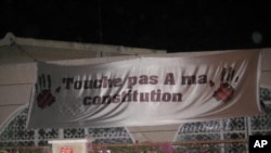 Senegalese demonstrate against President Wade's decision to run for re-election with signs reading “Don’t touch my constitution!” (December 2011)