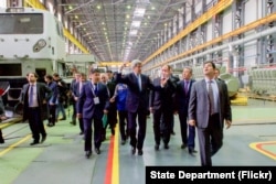 U.S. Secretary of State John Kerry walks through the Locomotive Plant during a tour in Astana, Kazakhstan on Nov. 2, 2015.