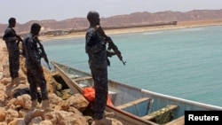 FILE - Somali Puntland forces are seen on the shores of the Gulf of Aden, in Bosaso, Puntland region, Somalia, Sept. 23, 2017.