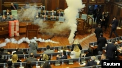 Kosovo opposition politicians release tear gas in parliament to obstruct a session in Pristina, Kosovo, March 21, 2018.