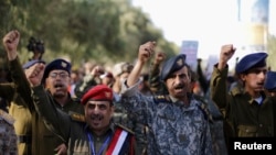 Army and police officers demonstrate to show their support for Yemen's Houthi movement in Sana'a, Feb. 2, 2015.