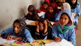 FILE - Afghan girls attend a class at the Aschiana center in Kabul, Afghanistan March 5, 2019.