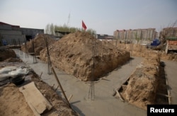 A construction site is pictured after it was stopped by local government on the outskirts of Xiongxian county, one part of the new special economic zone Xiong'an New Area, Hebei province, China April 3, 2017.