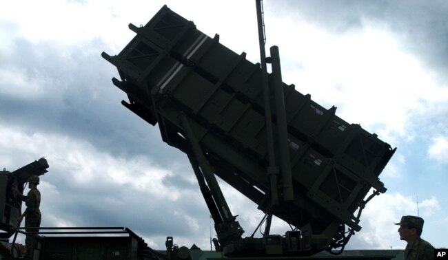 Taiwanese soldiers perform a launch preparation exercise on one of Taiwan's many Patriot missile air defense systems Friday, Oct. 22, 2004