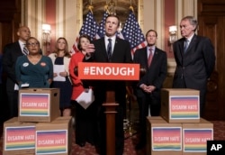Sen. Chris Murphy, D-Conn., center, and other Democratic senators call for gun control legislation in the wake of the mass shooting in an Orlando LGBT nightclub this week, at the Capitol in Washington, June 16, 2016.