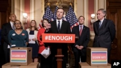 Sen. Chris Murphy, D-Conn., center, and other Democratic senators call for gun control legislation in the wake of the mass shooting in an Orlando LGBT nightclub, at the Capitol in Washington, June 16, 2016. 