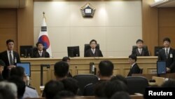 Judges sit to preside over verdicts of the sunken South Korean ferry Sewol's crew members are charged with negligence and abandonment of passengers in the disaster at Gwangju High Court in Gwangju, South Korea, April 28, 2015.